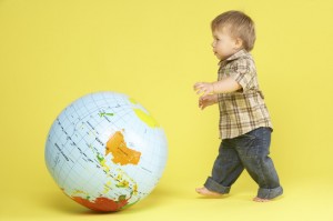 Toddler In Studio With Globe